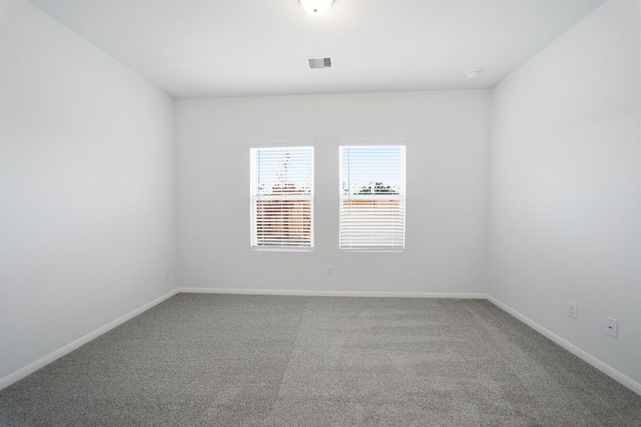 Spacious, unfurnished interior of a new home in The Pines at Seven Coves, Willis (Image 18).