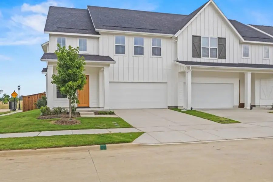 Front exterior of a new home in Uptown Celina, Celina, TX, highlighting curb appeal (Image 2). Front exterior of a new home in Uptown Celina, Celina, TX, highlighting curb appeal (Image 2).