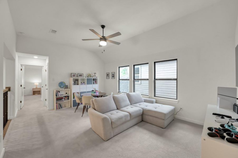 A versatile layout allows this area to serve as a media room, lounge, or entertainment hub.