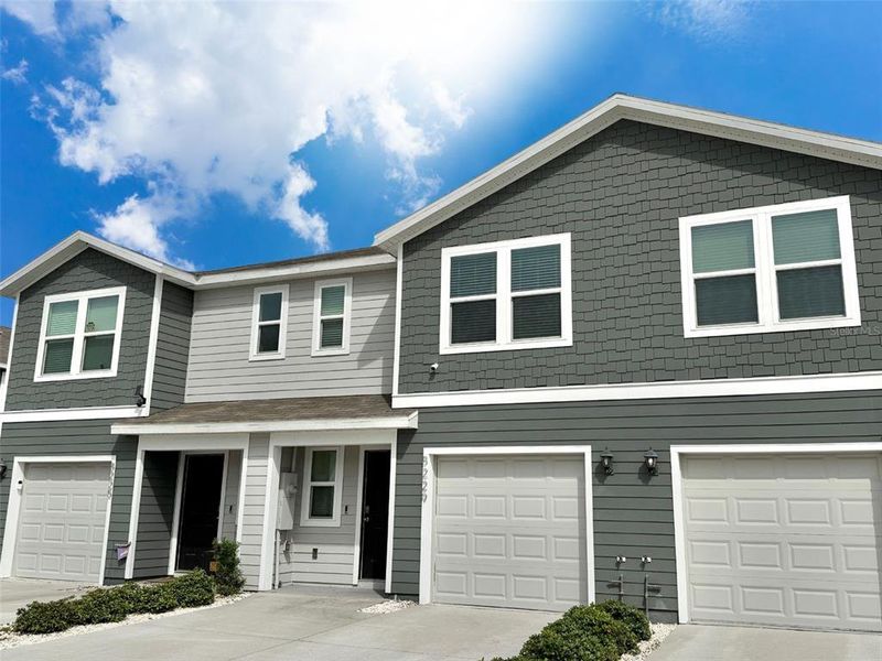 Front exterior of a new home in , Ocala, FL, highlighting curb appeal (Image 1). Front exterior of a new home in , Ocala, FL, highlighting curb appeal (Image 1).