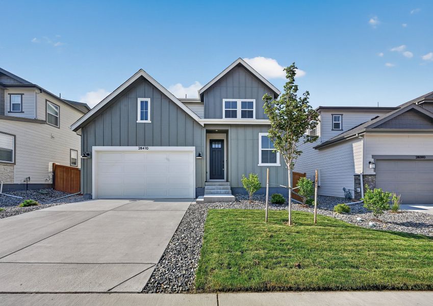 Front exterior of a new home in Sky Ranch, Watkins, CO, highlighting curb appeal (Image 1). Front exterior of a new home in Sky Ranch, Watkins, CO, highlighting curb appeal (Image 1).