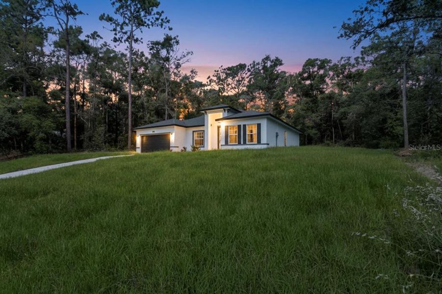 Front exterior of a new home in , Citrus Springs, FL, highlighting curb appeal (Image 20).