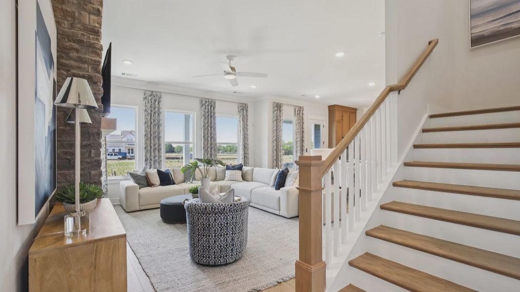 Bright and open concept first floor and staircase with oak treads and painted risers