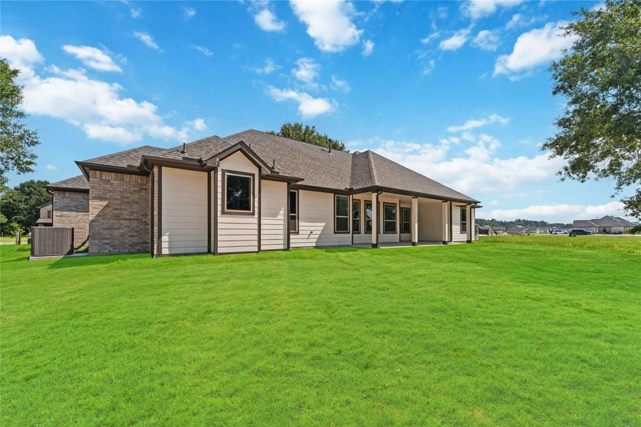 Front exterior of a new home in Barton Place, Cleveland, TX, highlighting curb appeal (Image 16). Front exterior of a new home in Barton Place, Cleveland, TX, highlighting curb appeal (Image 16).