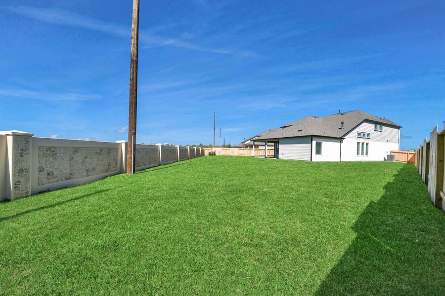 Backyard retreat, offering an abundance of space for kids to play and explore. The possibilities are endless in this outdoor haven, where the joy of open-air activities and family gatherings awaits.