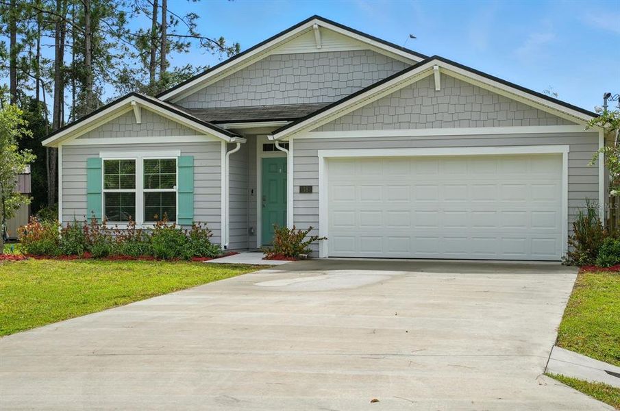 Front exterior of a new home in Palm Coast Homesites, Palm Coast, FL, highlighting curb appeal (Image 18).
