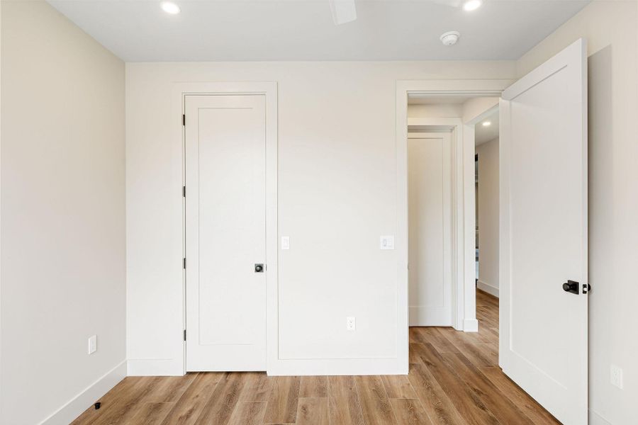 Unfurnished bedroom with recessed lighting, light wood-type flooring, and ceiling fan Unfurnished bedroom with recessed lighting, light wood-type flooring, and ceiling fan