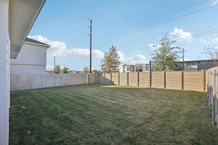 View of fenced backyard