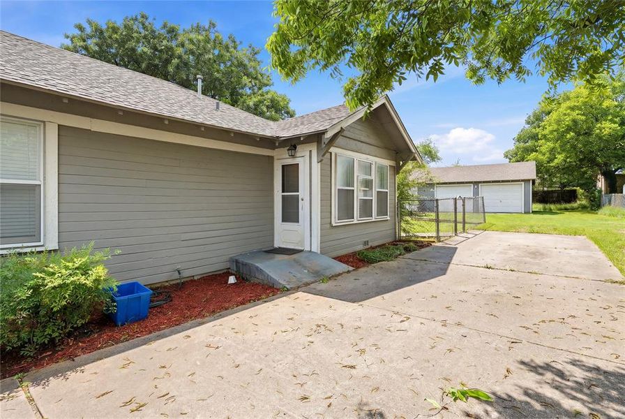 Concrete driveway with a detached two-car garage