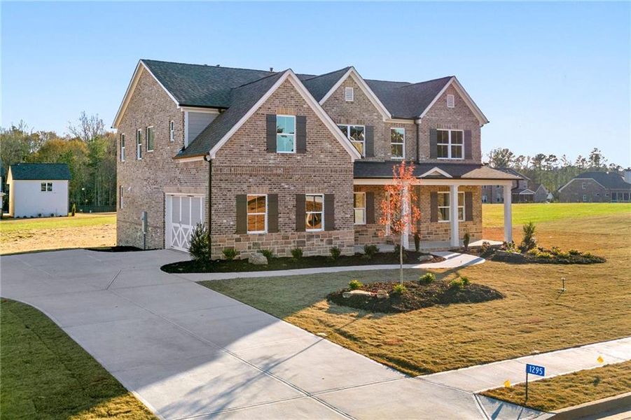Front exterior of a new home in , Watkinsville, GA, highlighting curb appeal (Image 1).