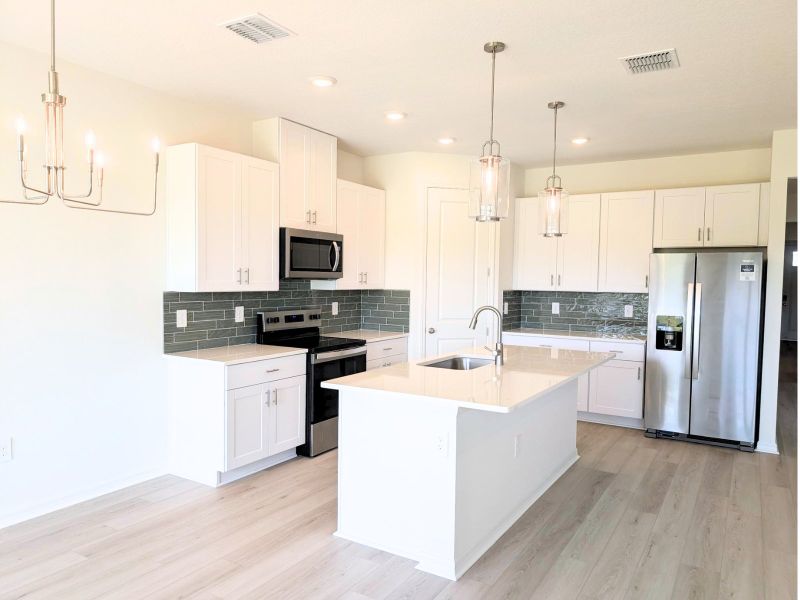 Furnished interior view inside a new home in Coasterra - Reserve Series, Palmetto (Image 6).
