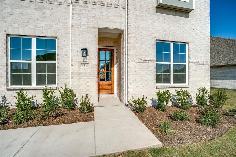 Exterior details and patio area of a home in West Crossing, Anna (Image 3). Exterior details and patio area of a home in West Crossing, Anna (Image 3).