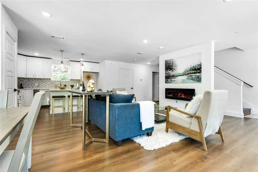 Living room with wood-type flooring