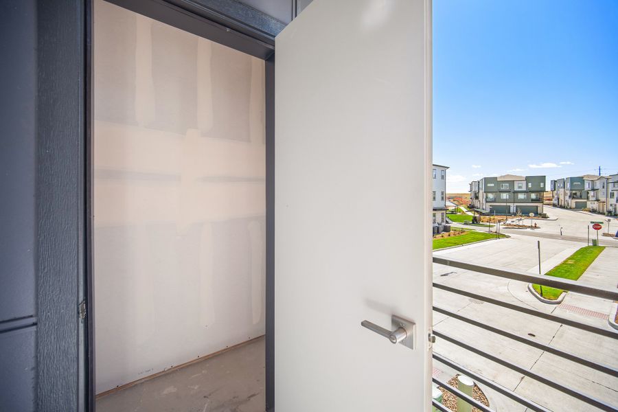 Exterior details and patio area of a home in Lyric at RidgeGate Condos, Lone Tree (Image 22).