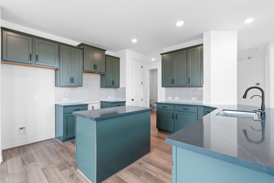 Open kitchen seamlessly connecting to the dining and living rooms for easy, everyday gathering and entertaining.