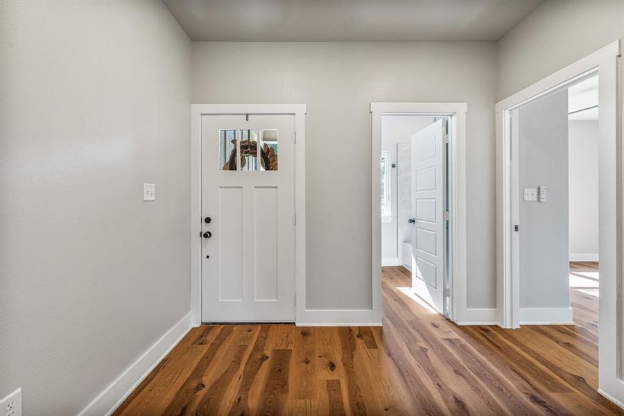 Entrance foyer featuring wood finished floors Entrance foyer featuring wood finished floors