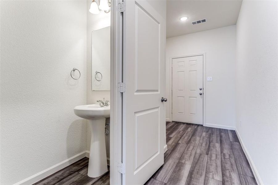 Bathroom with hardwood / wood-style flooring