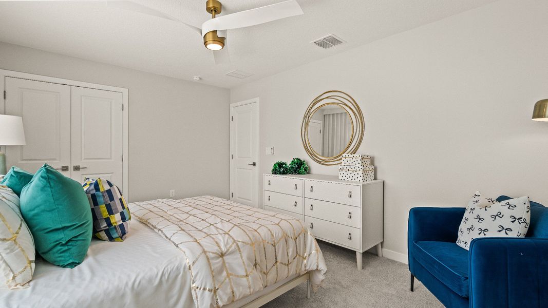 Secondary Bedroom with spacious closet in the Model Highbourne by DRB Homes in Hamilton Bluff located in Haines City, FL. Secondary Bedroom with spacious closet in the Model Highbourne by DRB Homes in Hamilton Bluff located in Haines City, FL.