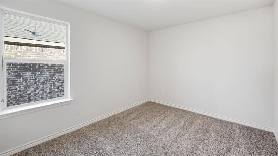 Unfurnished room featuring carpet flooring and baseboards Unfurnished room featuring carpet flooring and baseboards