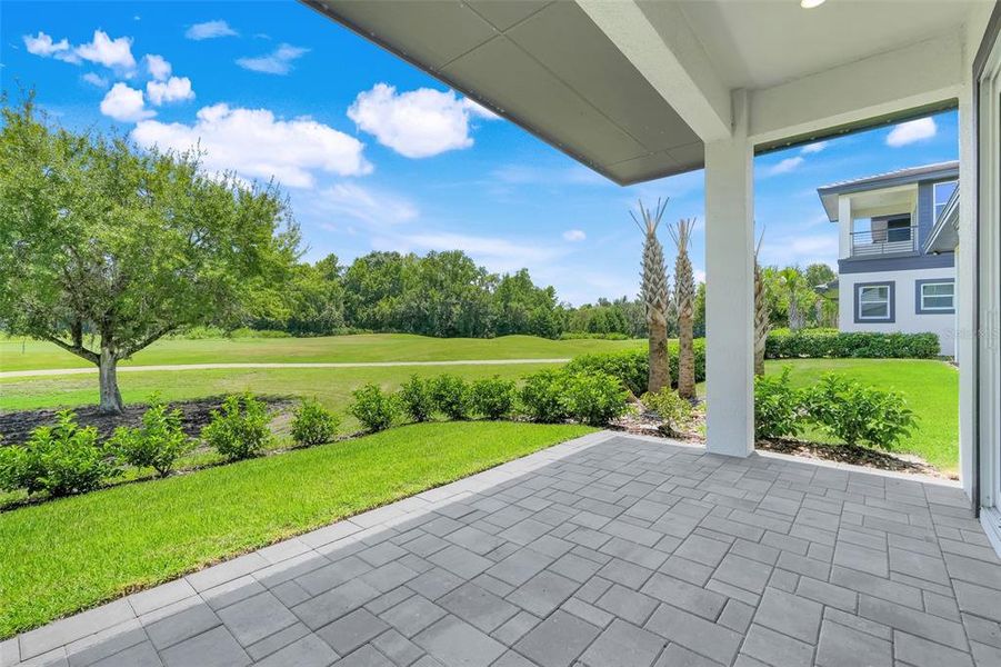 Exterior details and patio area of a home in Hampton Green at Providence, Davenport (Image 36).