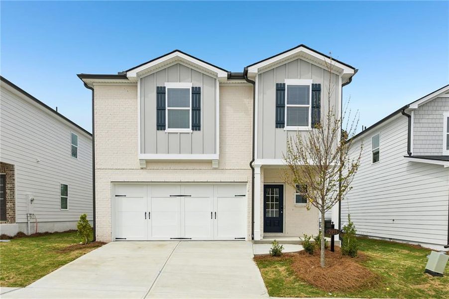 Front exterior of a new home in Hawthorne Station, College Park, GA, highlighting curb appeal (Image 2). Front exterior of a new home in Hawthorne Station, College Park, GA, highlighting curb appeal (Image 2).