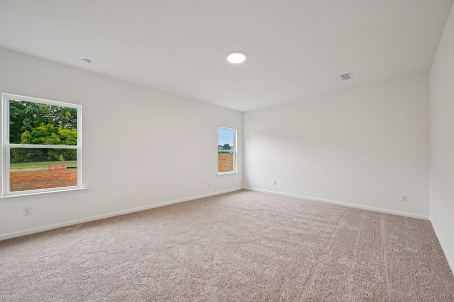 Representative unfurnished interior of a home built from the Macon by Ashton Woods in Rowland's Grant, Fuquay Varina (Image 42).