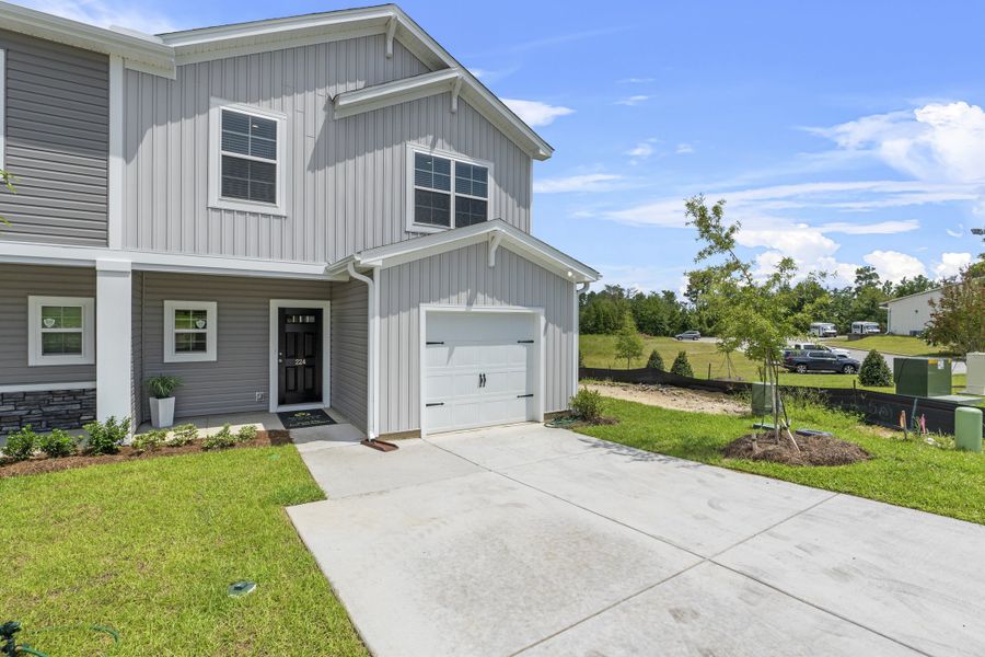Front exterior of a new home in South Lake Commons, Lexington, SC, highlighting curb appeal (Image 1).