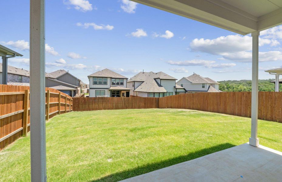 Front exterior of a new home in Saddleback at Santa Rita Ranch, Liberty Hill, TX, highlighting curb appeal (Image 1). Front exterior of a new home in Saddleback at Santa Rita Ranch, Liberty Hill, TX, highlighting curb appeal (Image 1).