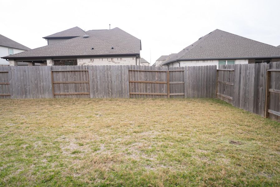 Exterior details and patio area of a home in Sunterra, Katy (Image 29).