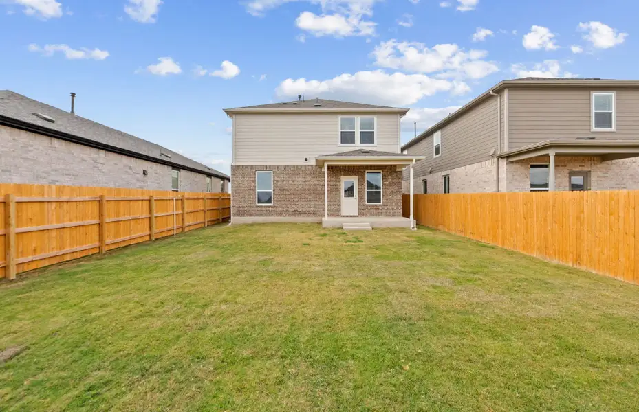 Exterior details and patio area of a home in Crosswinds, Kyle (Image 4).