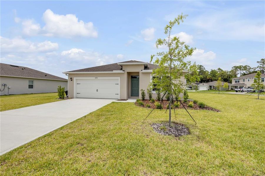 Front exterior of a new home in , New Smyrna Beach, FL, highlighting curb appeal (Image 22). Front exterior of a new home in , New Smyrna Beach, FL, highlighting curb appeal (Image 22).