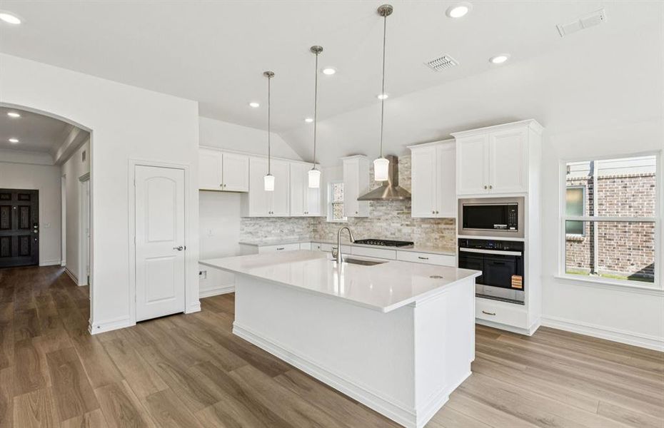 Spacious kitchen with eat-in bartop island Spacious kitchen with eat-in bartop island