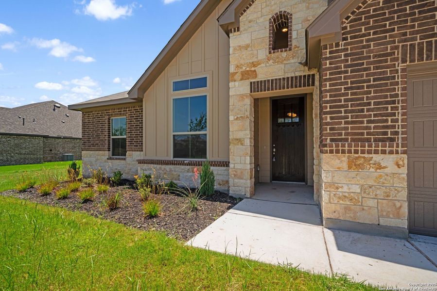 Front exterior of a new home in Annabelle Ranch, San Antonio, TX, highlighting curb appeal (Image 15). Front exterior of a new home in Annabelle Ranch, San Antonio, TX, highlighting curb appeal (Image 15).