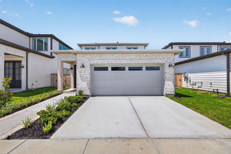 Front exterior of a new home in , Stafford, TX, highlighting curb appeal (Image 2). Front exterior of a new home in , Stafford, TX, highlighting curb appeal (Image 2).