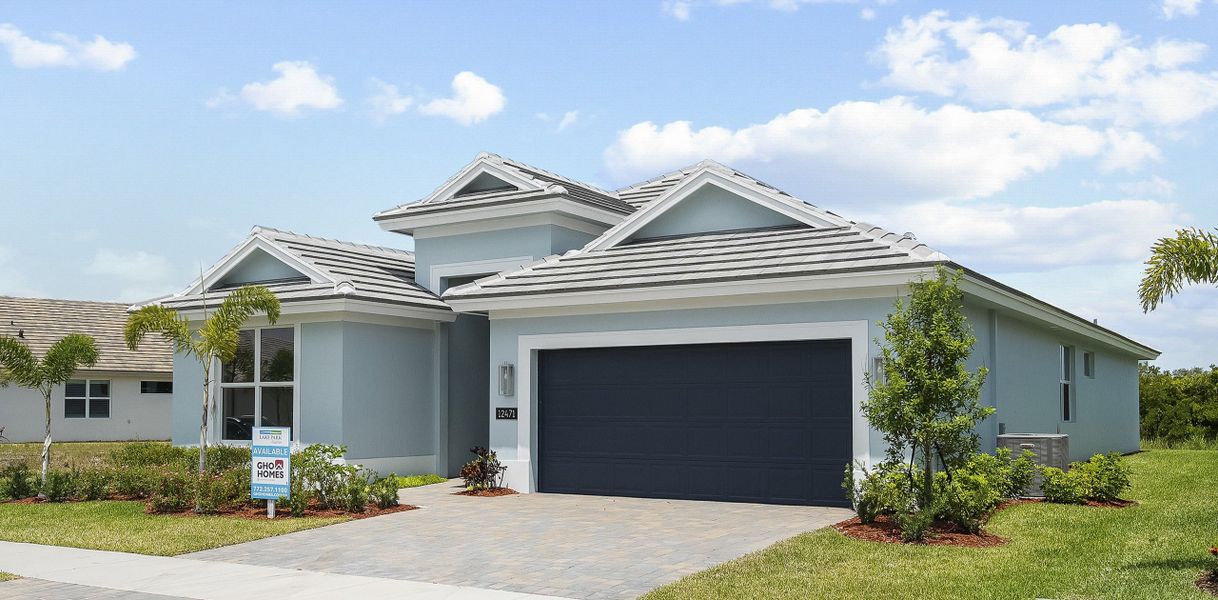 Front exterior of a new home in Lake Park at Tradition, Port St. Lucie, FL, highlighting curb appeal (Image 1).