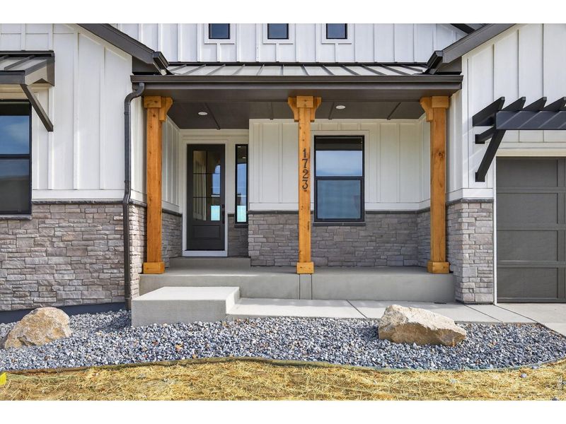 Exterior details and patio area of a home in RainDance, Windsor (Image 26).