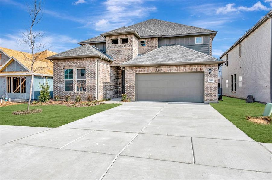 Front exterior of a new home in Vintage Village, Argyle, TX, highlighting curb appeal (Image 2). Front exterior of a new home in Vintage Village, Argyle, TX, highlighting curb appeal (Image 2).