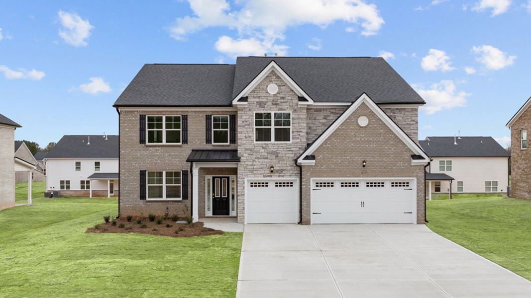 Front exterior of a new home in The Gates at Pates Creek, Hampton, GA, highlighting curb appeal (Image 1).