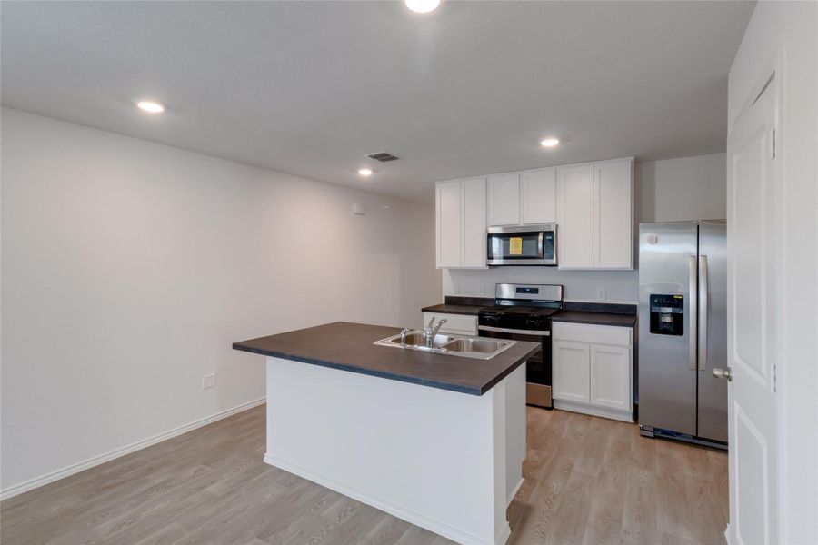 Furnished interior view inside a new home in Watermill, Uhland (Image 6).