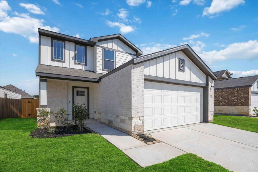Front exterior of a new home in Sandrock Station, Houston, TX, highlighting curb appeal (Image 2).