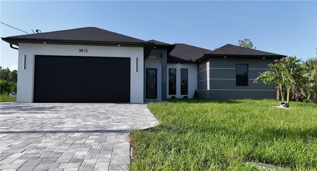 Front exterior of a new home in , Lehigh Acres, FL, highlighting curb appeal (Image 2). Front exterior of a new home in , Lehigh Acres, FL, highlighting curb appeal (Image 2).