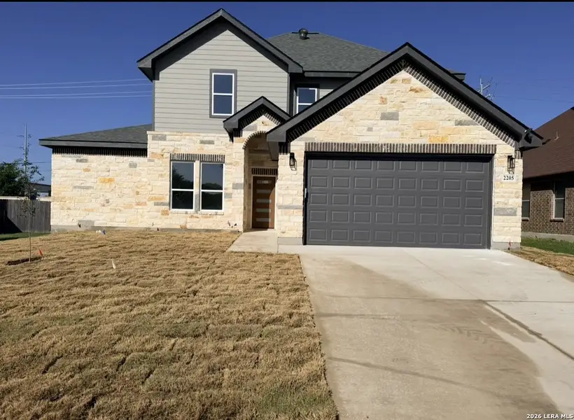 Front exterior of a new home in , Schertz, TX, highlighting curb appeal (Image 1). Front exterior of a new home in , Schertz, TX, highlighting curb appeal (Image 1).