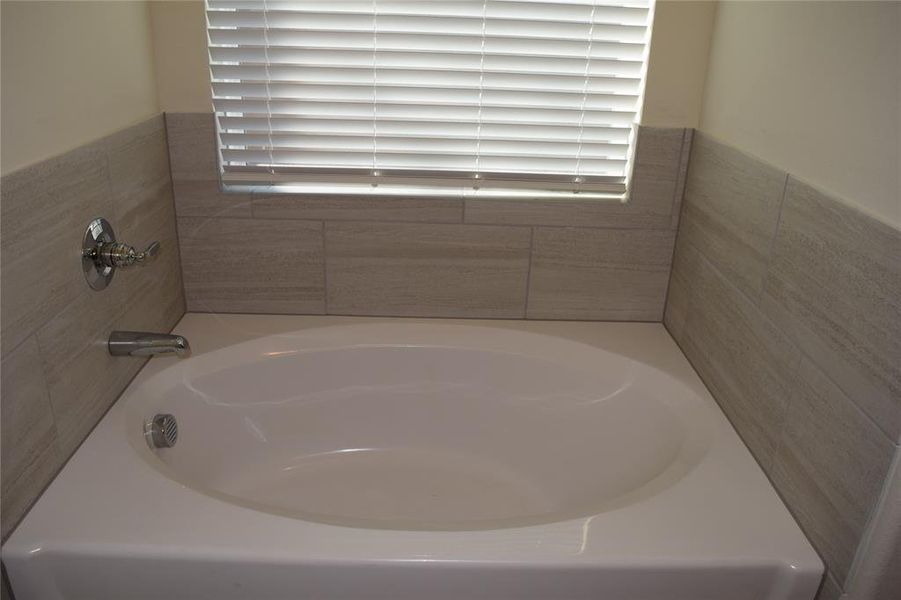 Full bath with a bath