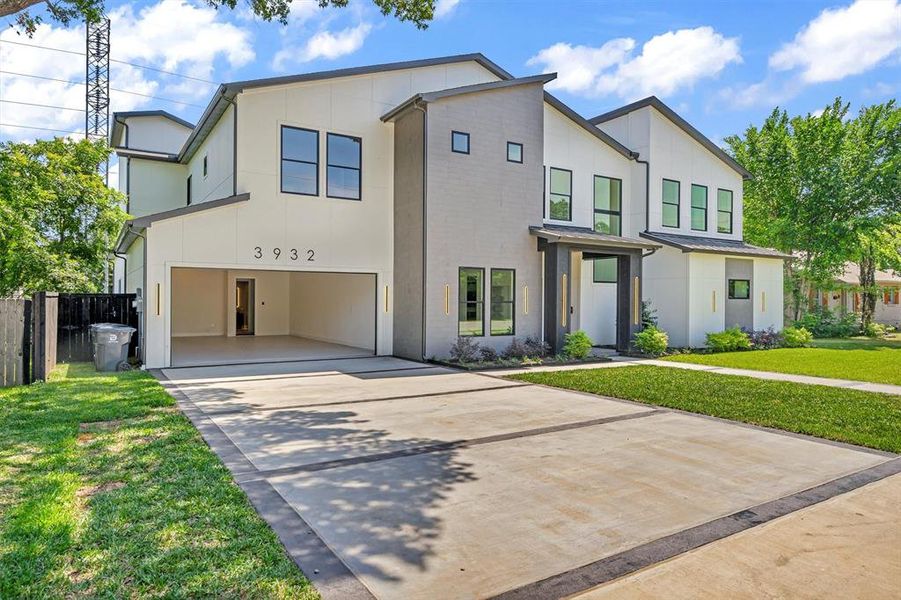 Contemporary house featuring concrete driveway and an attached garage