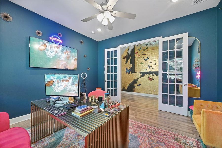 Office with ceiling fan, hardwood / wood-style floors, and french doors