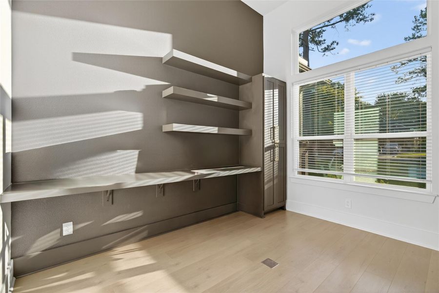 Dedicated home office provides a quiet, light-filled workspace with large windows and stylish contemporary finishes. **Images are from a previously completed project. **