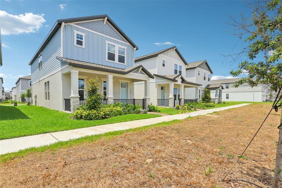 Front exterior of a new home in Silverleaf Reserve Bungalows, Winter Garden, FL, highlighting curb appeal (Image 2).
