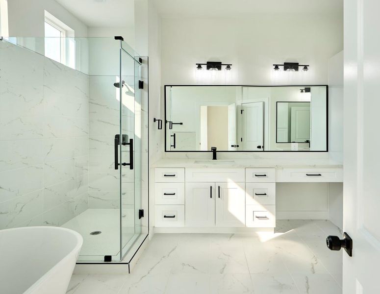 Pamper yourself in this luxurious primary bathroom complete with a separate soaking tub and a glass-enclosed walk-in shower. A tranquil retreat with contemporary finishes, it’s the ideal space to unwind. Pamper yourself in this luxurious primary bathroom complete with a separate soaking tub and a glass-enclosed walk-in shower. A tranquil retreat with contemporary finishes, it’s the ideal space to unwind.
