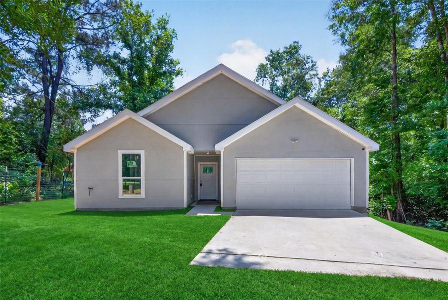 Front exterior of a new home in , Conroe, TX, highlighting curb appeal (Image 1). Front exterior of a new home in , Conroe, TX, highlighting curb appeal (Image 1).