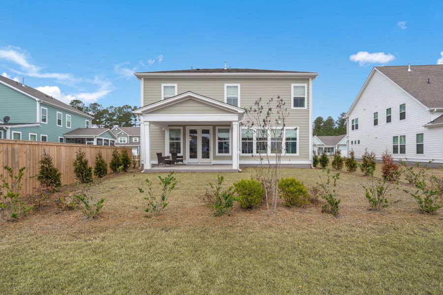 Exterior details and patio area of a home in Tidewater at Lakes of Cane Bay, Summerville (Image 24).